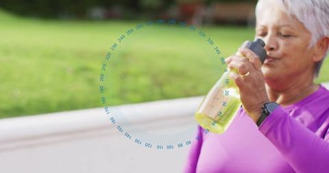 Elderly Woman Staying Hydrated During Outdoor Exercise