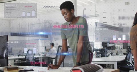 African American Businesswoman Using Tablet in High-Tech Office