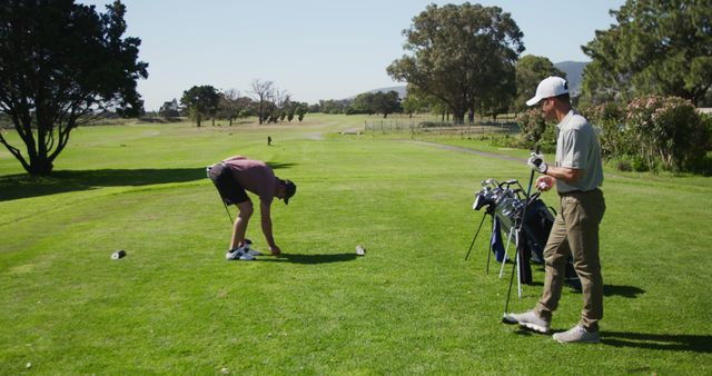 Friends Enjoying a Day Golfing on Sunny Golf Course - Download Free Stock Images Pikwizard.com