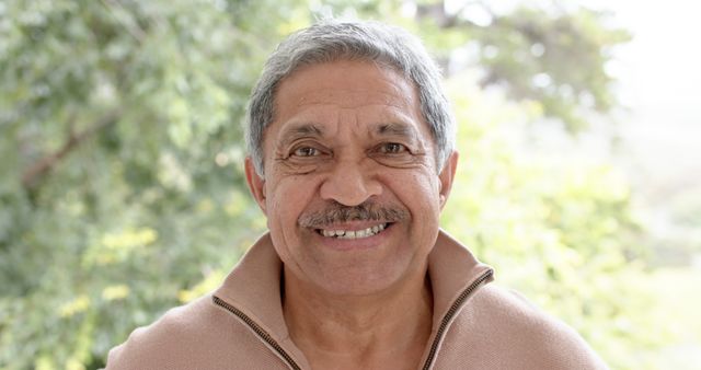 Smiling Elderly Man Relaxing Outdoors in Casual Sweater - Download Free Stock Images Pikwizard.com