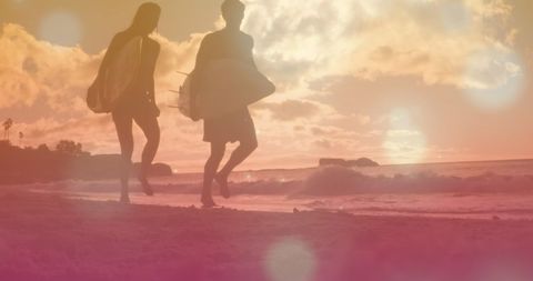 Silhouetted Surfer Couple Walking at Sunset Beach - Download Free Stock Images Pikwizard.com