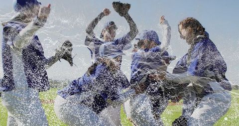 Jubilant Softball Team Celebrating Victory on the Field