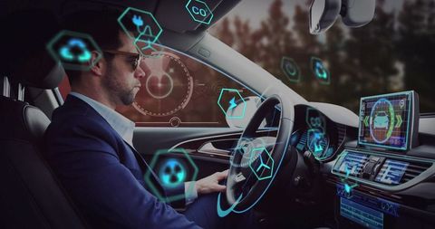 Driving businessman supervises ar interface in innovative vehicle