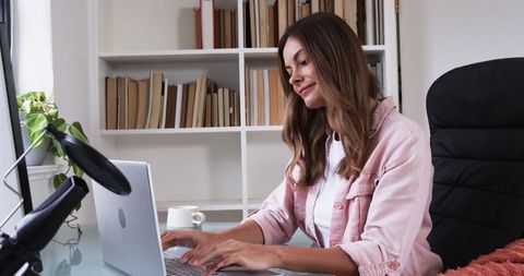 Confident Woman Creating Digital Content in Home Office Space
