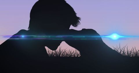 Silhouette of Person Bonding with Dog at Sunset