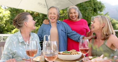 Senior Women Enjoying Outdoor Gathering with Wine and Snacks - Download Free Stock Images Pikwizard.com