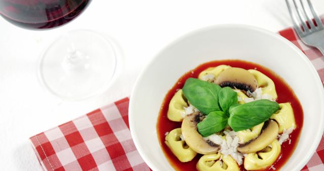 Delicious Tortellini with Tomato Sauce, Mushrooms, and Basil - Download Free Stock Images Pikwizard.com