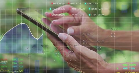 Person using tablet with digital financial analytics overlay