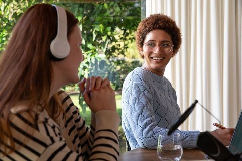 Diverse Coworkers Recording Podcast in Relaxed Home Office