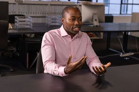 Professional discussion at modern open-plan office