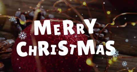 this festive image features a christmas greeting overlaid on red decorations and snowflakes, perfect for holiday cards, festive advertisements, or social media posts celebrating the christmas season.