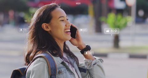 Asian Woman Engaging with Social Media via Smartphone