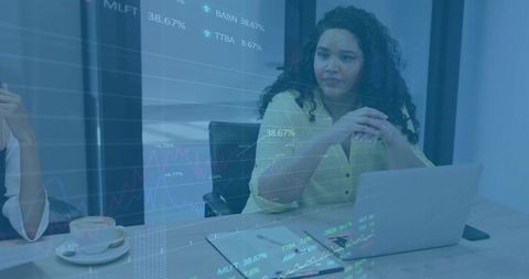 Business Professional Analyzing Stock Market Charts in Office Meeting Room