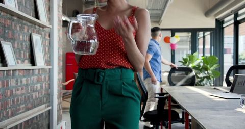 Colleagues Cleaning Office After Celebration Party