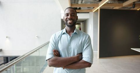 Confident Businessman Standing Proud in Modern Office Setting - Download Free Stock Images Pikwizard.com
