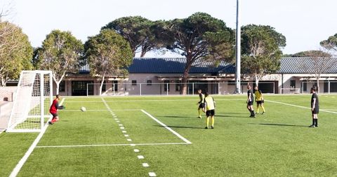 Soccer team in action attempting goal in intense match