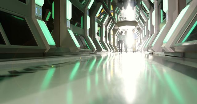 Futuristic corridor with glowing green lights and people walking - Download Free Stock Images Pikwizard.com