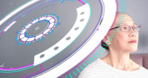 Senior woman gazing at holographic interface wearing glasses, futuristic home technology
