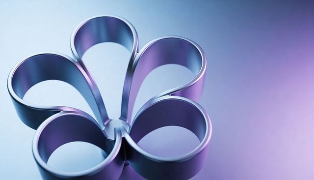 Modern metallic six-petal flower cutter with iridescent blue-purple reflection close-up