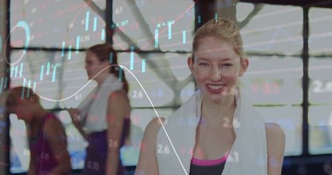 Smiling Young Woman in Gym with Stock Market Overlay