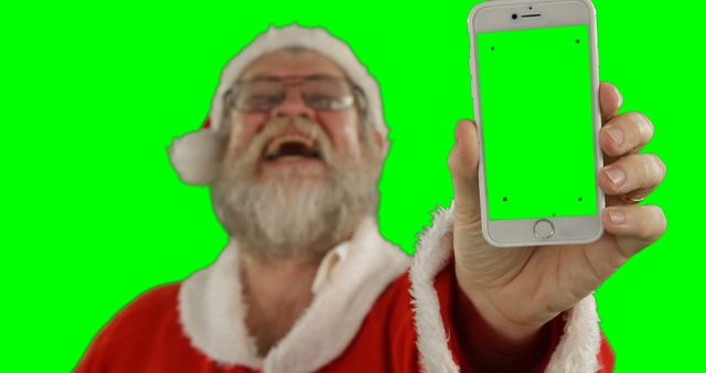 Santa Claus Holding Smartphone with Green Screen - Download Free Stock Images Pikwizard.com