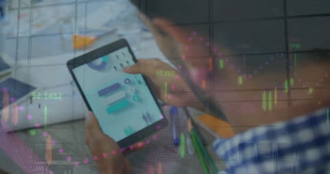 Caucasian Businessman Analyzing Digital Charts on Tablet