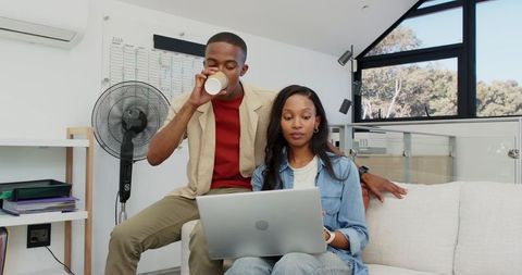 Coworkers Collaborating in Casual Home Office Environment