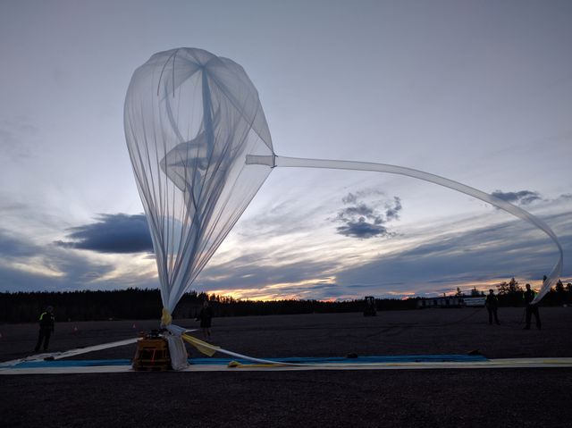 A BARREL balloon inflates on the launch pad at Esrange Space Center on Aug. 29, 2016.   Throughout August 2016, the BARREL team was at Esrange Space Center near Kiruna, Sweden, launching a series of six scientific payloads on miniature scientific balloons. The NASA-funded BARREL – which stands for Balloon Array for Radiation-belt Relativistic Electron Losses – primarily measures X-rays in Earth’s atmosphere near the North and South Poles. These X-rays are produced by electrons raining down into the atmosphere from two giant swaths of radiation that surround Earth, called the Van Allen belts. Learning about the radiation near Earth helps us to better protect our satellites.   Several of the BARREL balloons also carried instruments built by undergraduate students to measure the total electron content of Earth’s ionosphere, as well as the low-frequency electromagnetic waves that help to scatter electrons into Earth’s atmosphere. Though about 90 feet in diameter, the BARREL balloons are much smaller than standard football stadium-sized scientific balloons.  This is the fourth campaign for the BARREL mission. BARREL is led by Dartmouth College in Hanover, New Hampshire. The undergraduate student instrument team is led by the University of Houston and funded by the Undergraduate Student Instrument Project out of NASA’s Wallops Flight Facility. For more information on NASA’s scientific balloon program, visit: <a href="http://www.nasa.gov/scientificballoons" rel="nofollow">www.nasa.gov/scientificballoons</a>.   Credit: NASA/Dartmouth/Alexa Halford  <b><a href="http://www.nasa.gov/audience/formedia/features/MP_Photo_Guidelines.html" rel="nofollow">NASA image use policy.</a></b>  <b><a href="http://www.nasa.gov/centers/goddard/home/index.html" rel="nofollow">NASA Goddard Space Flight Center</a></b> enables NASA’s mission through four scientific endeavors: Earth Science, Heliophysics, Solar System Exploration, and Astrophysics. Goddard plays a leading role in NASA’s accomplishments by contributing compelling scientific knowledge to advance the Agency’s mission.  <b>Follow us on <a href="http://twitter.com/NASAGoddardPix" rel="nofollow">Twitter</a></b>  <b>Like us on <a href="http://www.facebook.com/pages/Greenbelt-MD/NASA-Goddard/395013845897?ref=tsd" rel="nofollow">Facebook</a></b>  <b>Find us on <a href="http://instagrid.me/nasagoddard/?vm=grid" rel="nofollow">Instagram</a></b>    