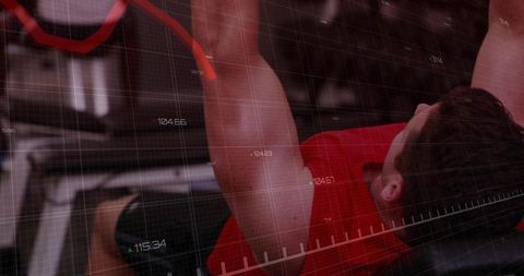Male athlete pressing barbell on flat bench with digital analytics for strength training