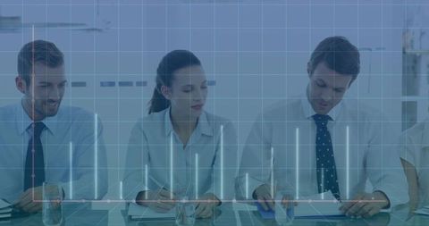 Business Team Reviewing Documents with Digital Graph Overlay in Meeting Room