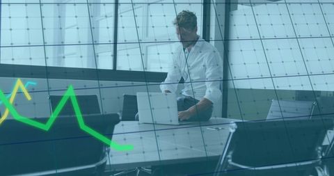 Business Executive Analyzing Financial Trends on Laptop