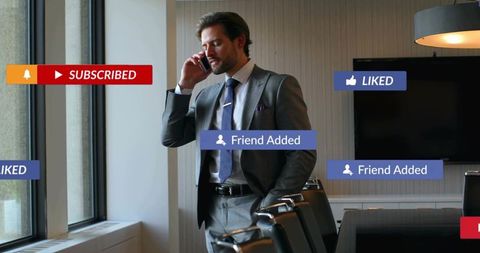 Businessman talking on phone in boardroom with social media notification overlays