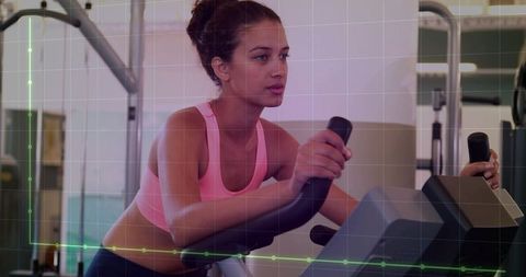 Woman Exercising on Stationary Bike with Performance Metrics
