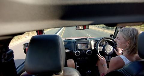 Young Woman Enjoying Sunny Road Trip Journey - Download Free Stock Images Pikwizard.com