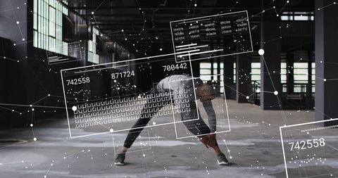 Male athlete stretching in industrial loft with augmented reality hud and data overlays