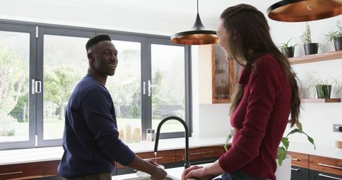 Happy Couple Engaging in Kitchen Activity with Relaxed Atmosphere