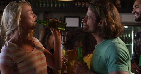 Friends Enjoying Drinks and Conversations at Bar