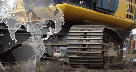 Heavy Machinery at Construction Site with Global Industry Concept