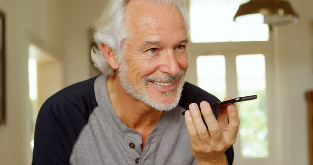 Happy Senior Man Using Smartphone Voice Command at Home - Download Free Stock Images Pikwizard.com