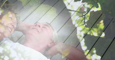 Happy senior man relaxing amid glowing light inspiration