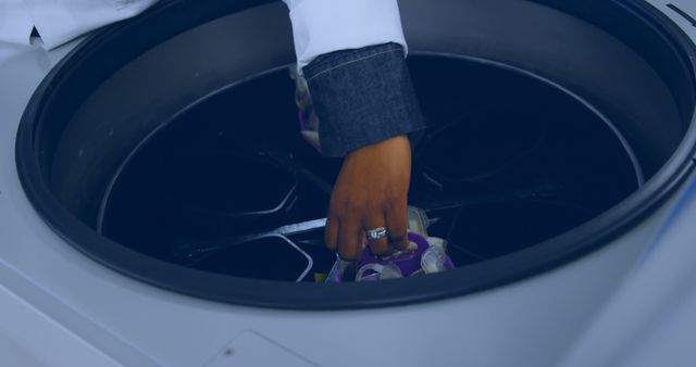 Scientist Placing Samples in Laboratory Centrifuge Machine - Download Free Stock Images Pikwizard.com