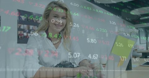 Confident Businesswoman Analyzing Stock Market Trends Using Laptop