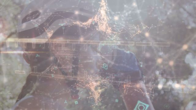 This video portrays a Caucasian female athlete wearing helmet and goggles, enhanced by an overlay of abstract digital lines and nodes. It conveys themes of protection, technological advancement, and an active lifestyle. This visual is ideal for use in promoting sports equipment, cybersecurity technology, digital fitness platforms, or futuristic concepts. It can be used in campaigns that blend sports and technology or for articles highlighting advancements in fitness tech.