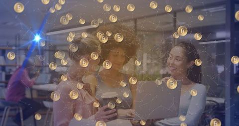 Businesswomen reviewing cryptocurrency trends in modern office