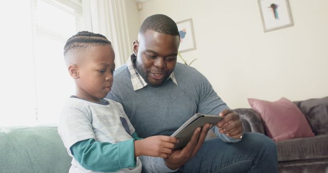 Father and Son Bonding with Tablet at Home - Download Free Stock Images Pikwizard.com