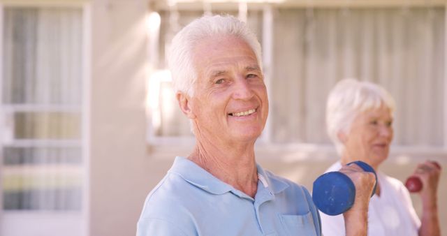 Senior Couple Exercising with Dumbbells Outdoors In Daylight - Download Free Stock Images Pikwizard.com