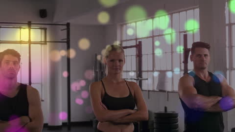 Diverse Gym Team Standing with Crossed Arms and Sparkle Overlay