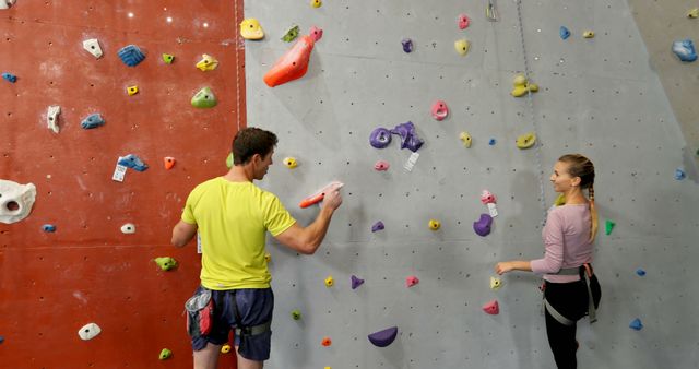 People Rock Climbing Indoors on Colorful Climbing Wall - Download Free Stock Images Pikwizard.com