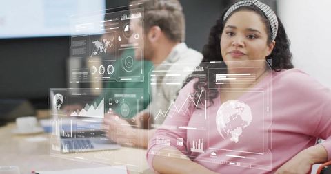 Businesswoman Analyzing Digital Data in Office Meeting