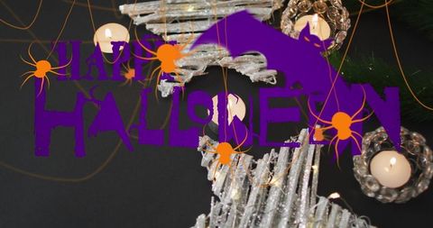 Gothic halloween tabletop with candle glow and festive symbols